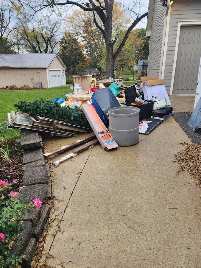 Dumpster being loaded with debris for Commercial Dumpster Rental in Chesterfield